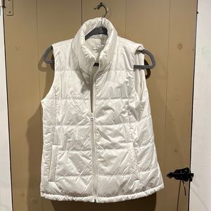 White vest, fur lined.